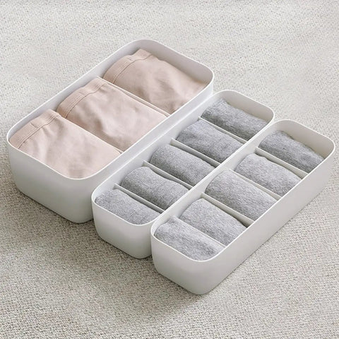 Stackable Plastic Underwear Storage Containers With Divided Compartments To Straighten Up Your Wardrobe Kick Clutter To The Curb Keeping Socks Bras Neck Ties Squeaky Fresh, featuring grey organizers with rolled socks.