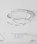 Tough As Nails Smoke Sensor Protective Cage with white polypropylene construction, mounted on ceiling for office safety.