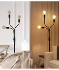 Dimmable Industrial Floor Lamp With 3 Adjustable Gooseneck Arms, Tall Tree-Style Farmhouse Standing Lamp For Living Room, Bedroom, Office, And Home Decor, 67 Inch High Black Metal Finish in a room setting.