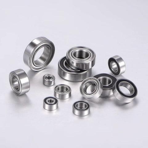 Rock Solid Stainless Steel Ball Bearings Five Pack Dual Sealed SR188ZZ ABEC P6 in various sizes on a gray surface.