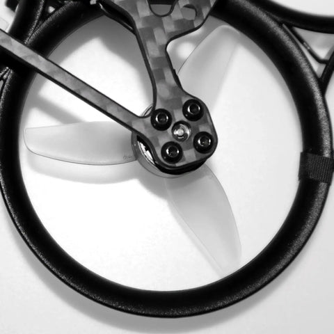 Close-up of Dope 12 Piece T Mount 2.2 Inch Propeller Set for Drones on FPV quadcopter frame with 3-blade design.