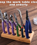 Wood Pliers Block Organizer for the Bench fits 6 pairs in a 12 hole rack with pliers on wooden table