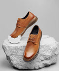 Premium Rubber Sole Protectors For Sneakers And Boots With 4mm Anti Scuff Heel Pads on brown casual shoes on display.
