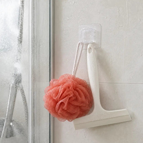 Sick Wall Mount Hooks, Totally Rust Proof Storage Rack For Coats, Bags, And Picture Hanging, Rad Home Organization Gear holding a shower squeegee and a loofah.