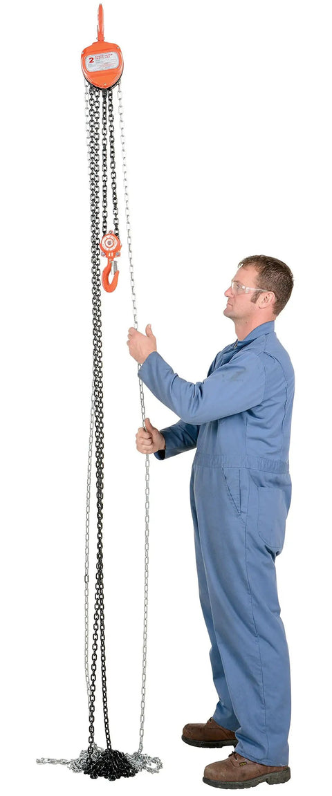 Man using Heavy Duty Manual Chain Hoist For Industrial Use 15 Ft Lift 4000 Lb Capacity Grade 80 Chain Stamped Steel Housing