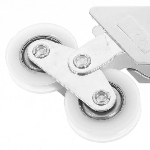 Close-up of Four Piece Heavy Duty Aluminum Pulley Rollers For Smooth Sliding Doors And Windows Straight Up Quick Swap Garage Track Replacement Hardware.