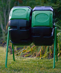 37 Gallon Dual Chamber Tumbling Composter For Backyards in garden setting with green and black design, easy turn barrel.