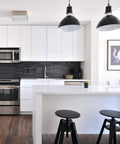 Modern kitchen with dark pendant lights, white cabinetry, and A19 Led Light Bulbs 9W, 60W Equivalent, E26 Base, Daylight White 5000K.