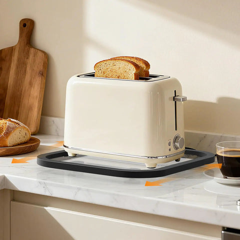 Slick Acrylic Appliance Slider With Smooth Gliding Wheels Move Coffee Makers And Air Fryers Without A Sweat Countertop Protector Dolly Protects Surfaces Zero Strain Kitchen Essential with a toaster on a countertop.