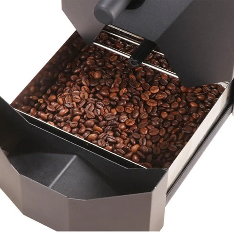 Close-up of Electric Automatic Coffee Bean Roasting Machine Featuring Nine Pro Roast Curves And Built In Smoke Filter For Dead Simple Home Shop Use And Consistently Smooth Cafe Style Flavor Daily with roasted coffee beans.