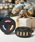 Bluetooth Shower Speaker With LED Light, IP67 Waterproof And Floating, in front of a gift box, showing glowing LED lights.