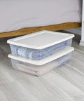 Totally Dope 28 Quart Storage Bins 2 Pack Featuring Crisp Clear View And Snug Snap Lid For Legit Closet Organization Bedroom Glow Up Or Dorm Room Must Haves In Classic White, with stacked bins holding folded blankets.