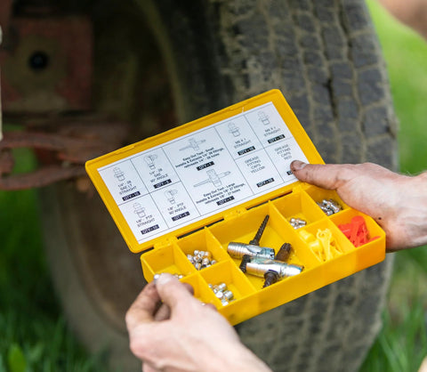LockNLube grease fitting multi-tool small in open yellow case with assorted fittings