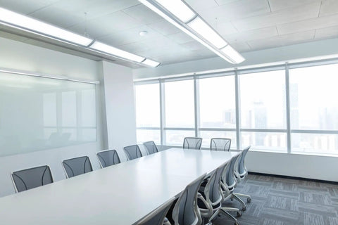 Dope Ceiling Motion Sensor With 360 Degree Coverage visible in modern office conference room setup