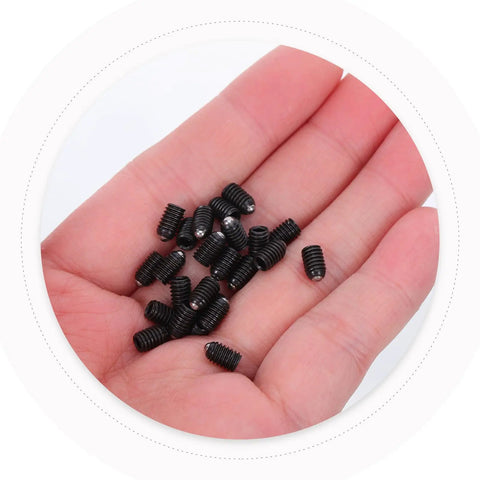 Rock Solid M4x6 Stainless Steel Ball Point Spring Plunger Set Screws 50 Pieces in hand, black coated, durable precision hardware.
