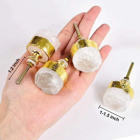 Four Pack Real Deal Natural Clear Quartz Crystal Cabinet Knobs With Gold Plated Solid Brass Base For Drawers And Dressers Smooth Everyday Premium Hardware in hand, size 1-1.5 inch, showing detail.