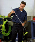 Man holding part of Ergonomic 6 Piece Blow Gun Kit With Variable Flow Trigger For Precise Air Control In Green Finish X3 Gun Bodies AG1200FZKIT