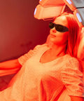 Woman using Laser Eye Protection Glasses For IPL Hair Removal And Facial Treatments during a cosmetic procedure under LED lights.