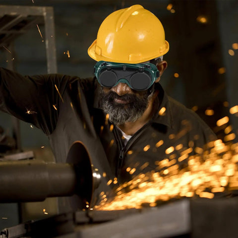 Job Site Tough Flip Up Welding Safety Glasses With Vented Anti Fog Shell Double Layer Shatterproof Lenses For Stick Mig Argon Cuts And Everyday Shop Grinds 2 Pack worn by worker with a yellow hard hat.