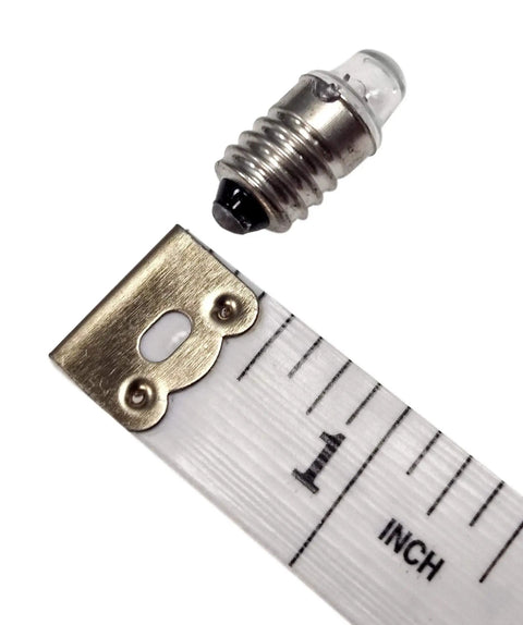 Pack Of 10 E10 Miniature Screw Base Light Bulbs 2.5 Volt 0.3 Amp shown next to a ruler for size comparison.