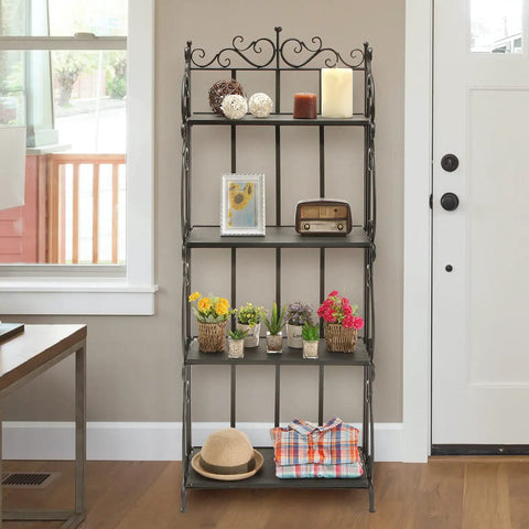 Black Metal Freestanding Storage Rack With Four Wood Shelves And Decorative Scrollwork displaying plants, photos, and decorative items.