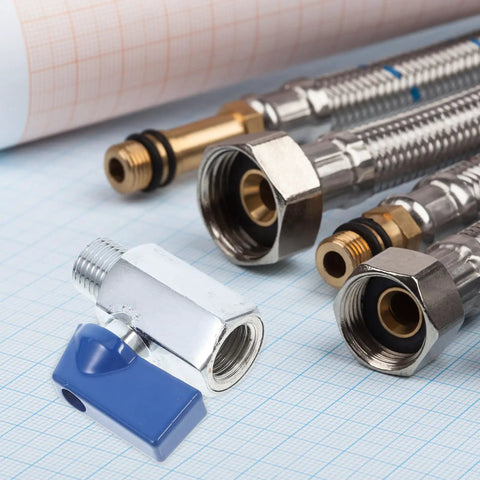 Crush Your Projects With This Rock Solid 1/4 Inch Brass Mini Ball Valve among brass plumbing connectors on grid paper.