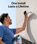 Man installing Solar Powered Outdoor Security Cam With 2K Resolution No Subscriptions Built In 8GB Storage Wireless Setup