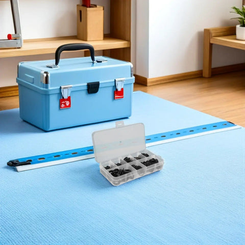 Plastic Flat Washers Assortment Kit For Electrical Outlet Mounting And Hardware Spacers, Oversized Cushioned Washers With Enhanced Insulation, Black Durable Gaskets For Bolts, Screws, And Shim Applications In Home And Industrial Projects. Open organizer with black plastic washers on a blue work surface