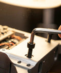 Rock Solid M2 X35MM Hex Socket Head Cap Screws Grade 12.9 Alloy Steel in use on a machine with an Allen wrench.
