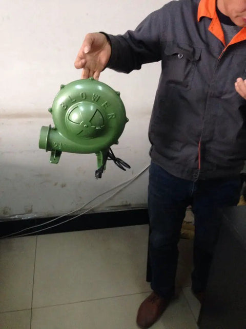 Person holding Electric Blacksmith Forge Blower 110V 250W For Coal Fires, High CFM Draft Fan With 380Pa Pressure