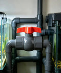 3/4 In SCH80 PVC Ball Valve Socket To Socket Shut Off Valve Quarter Turn Handle controlling water flow in a plumbing setup.