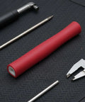 Red Universal Fencing Handle Replacement Grip With Ergonomic Rubber Non Slip Straight Design displayed on textured mat.