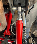 Beefy 3/4 Inch Heim Joint Rod End Kit With Heat Treated Chromoly Sleeves Precision Threads And Locking Jam Nuts installed on a vehicle.