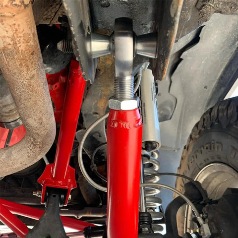 Beefy 3/4 Inch Heim Joint Rod End Kit With Heat Treated Chromoly Sleeves Precision Threads And Locking Jam Nuts installed on a vehicle.