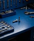 Two Piece Grease Gun Fitting Nozzle Coupler Set For Automotive And Outdoor Use on blue workshop table