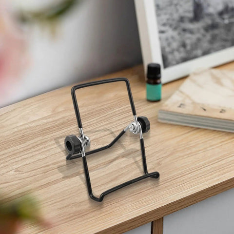 Two Pack Foldable Solar Panel Stands With Adjustable Tilt Mounts For Small And Large Panels on a wooden desk