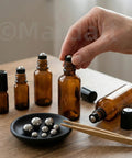 Boss Grade 620 Piece 304 Stainless Steel Ball Assortment Kit featuring six sizes with amber bottles and a black dish.