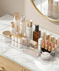 4 Pack 15x6 Inch Extra Large Clear Plastic Drawer Organizer Trays holding makeup items on a vanity.