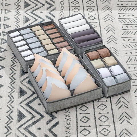 Four Piece Slick Underwear Storage Organizers Featuring Nifty Grid Layouts For Foldable Oxford Fabric Drawer Bins And Wardrobe Packing Boxes Keeping Your Daily Gear Straight Up Neat And Secure, showcasing organized bras and rolls of clothing.