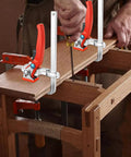 Two Pack Ratcheting Table Clamps With Quick Bar For Easy Grip, 0 To 6 Inch Clamping Range, Beefy Heavy Duty F Clamp For MFT Tables And Guide Rail Systems, 353 Lb Grip, Alloy Steel Track Saw Clamp Set securing wooden board on table.