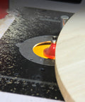 Rock Solid Router Lifting System With Slick Crank Adjustment, sturdy router mounted in a table with wood shavings scattered.