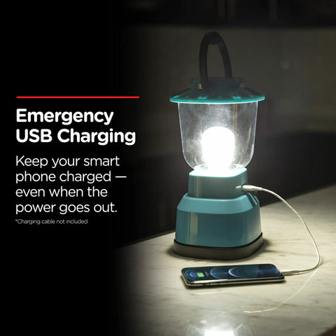 LED Camping Lantern With USB Charging, 800 Lumens Of Bright Light, Battery Powered And 200 Hour Run Time on table with phone charging