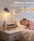 Vintage Battery Operated Wall Sconce With Amber Tulip Glass Lampshade beside a sleeping child on a bedside table.