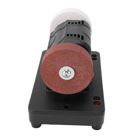 Compact Bench Grinder With Smooth Variable Speed 2000 To 6000 RPM showing red grinding wheel and motor on sturdy base.