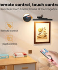 Rechargeable 12 Inch Wireless Picture Light With Dimmable LED illuminating wall art with remote and touch control shown.
