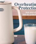 Side view of cream white Big 1.7L Electric Kettle For Tea And Coffee Lovers with a glass of milk, featuring auto shut-off