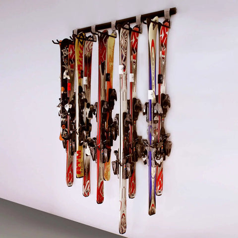 Heavy Duty Wall Mounted Ski And Snowboard Rack Featuring Five Slick Storage Hooks Badass Garage Space Organizer Solid 48 Inch Rail For Gnarly Winter Gear Stash showcasing multiple skis neatly hung on wall.