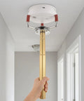 Dead Nuts Smoke Transducer Removal Tool For Ladder Free Sensor Disassembly And Ceiling Height Fire Alarm Building Maintenance With Heavy Duty Aluminum Claw Head in use reaching a ceiling sensor.