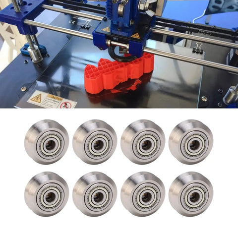 Top Shelf 13 Piece V Groove Guide Pulley Kit Featuring Heavy Duty Stainless Steel Bearings, 8 steel bearings on a table.