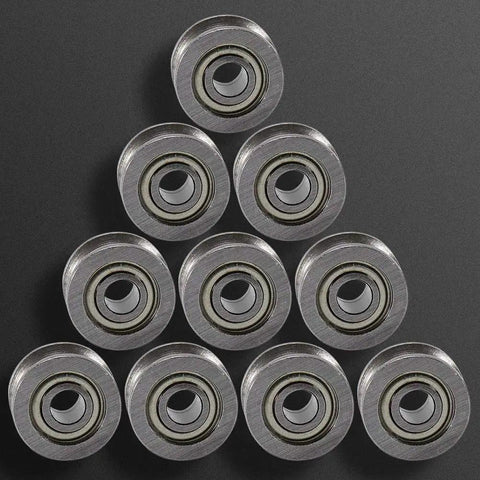 Built Tough Mini Ball Bearings Featuring A Slick U Groove Design And Heavy Gauge Carbon Steel For Silky Smooth Rail Track Glide And Rock Solid 4X13X7MM Performance In A 10 Pack Pro Hardware Kit arranged in a pyramid shape.